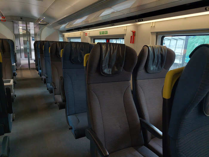 The interior of the train had a dark blue color scheme with hints of yellow, like the Eurostar logo.