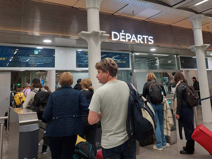 Tickets are scanned at the barriers before passing through security like at airports. Passengers also get their passports stamped. Despite a long queue, it was relatively fast-moving, and the process only took about 30 minutes.