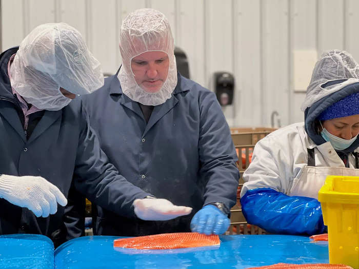 Once the fish are fully grown, they are harvested by hand at the facility. I toured this part of the building where I, along with all employees, was required to wear boots, a coat, a hair net, and a mask. Those with facial hair had to also wear a beard net.