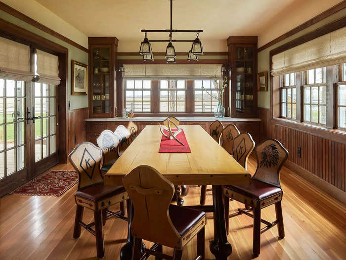 Adjacent to the kitchen is the dining room, with windows on all three sides.