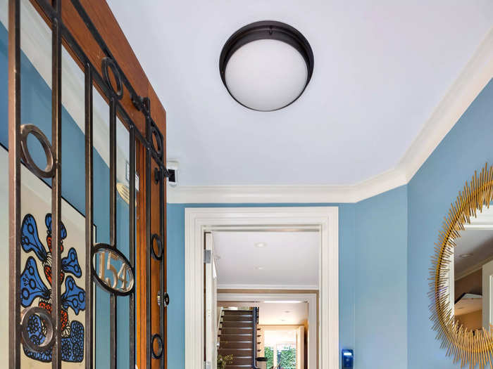 The ground-floor foyer invites guests into the home that Reynolds and the Fisher children walked through each day.