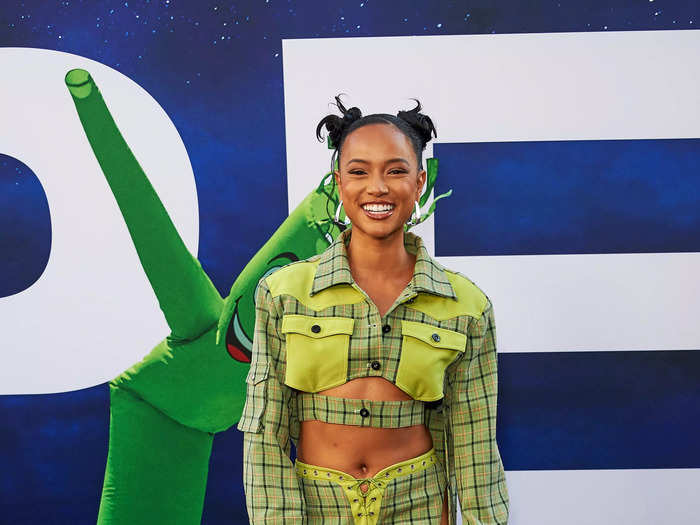 Karrueche Tran brought a pop of neon to the red carpet with her western-inspired jacket and pants.