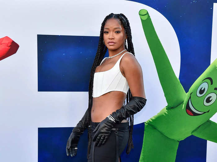 Following suit in another black-and-white ensemble, Keke Palmer opted for a white bralette and a column skirt with a high slit.