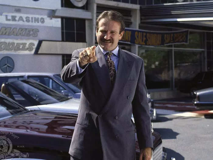 Williams stars as a car salesman whose dealership gets taken hostage in 1990