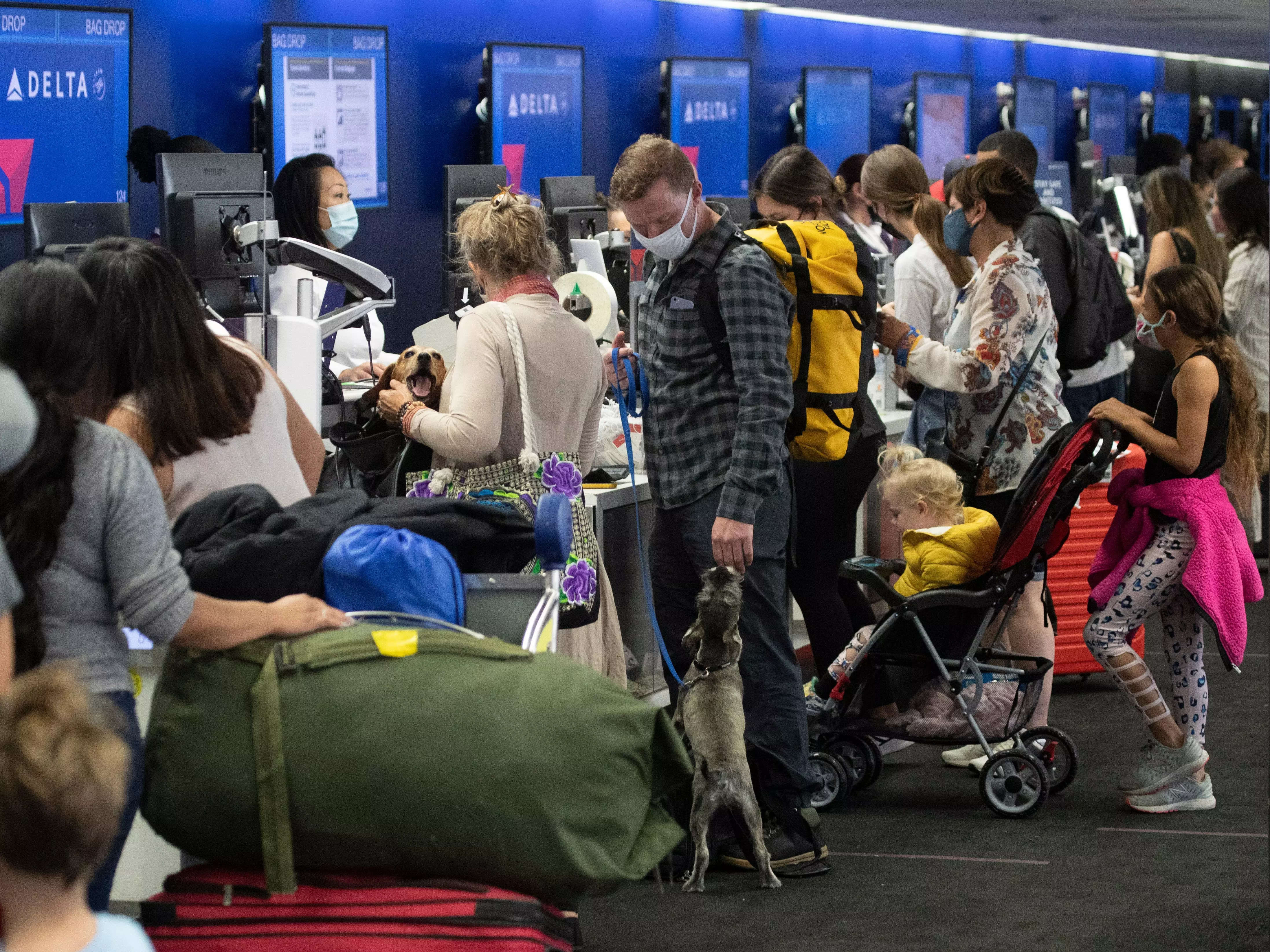 A crowd of travelers check in for their flights on Memorial Day weekend. Over 3,000 flights were delayed or cancelled over the holiday weekend.