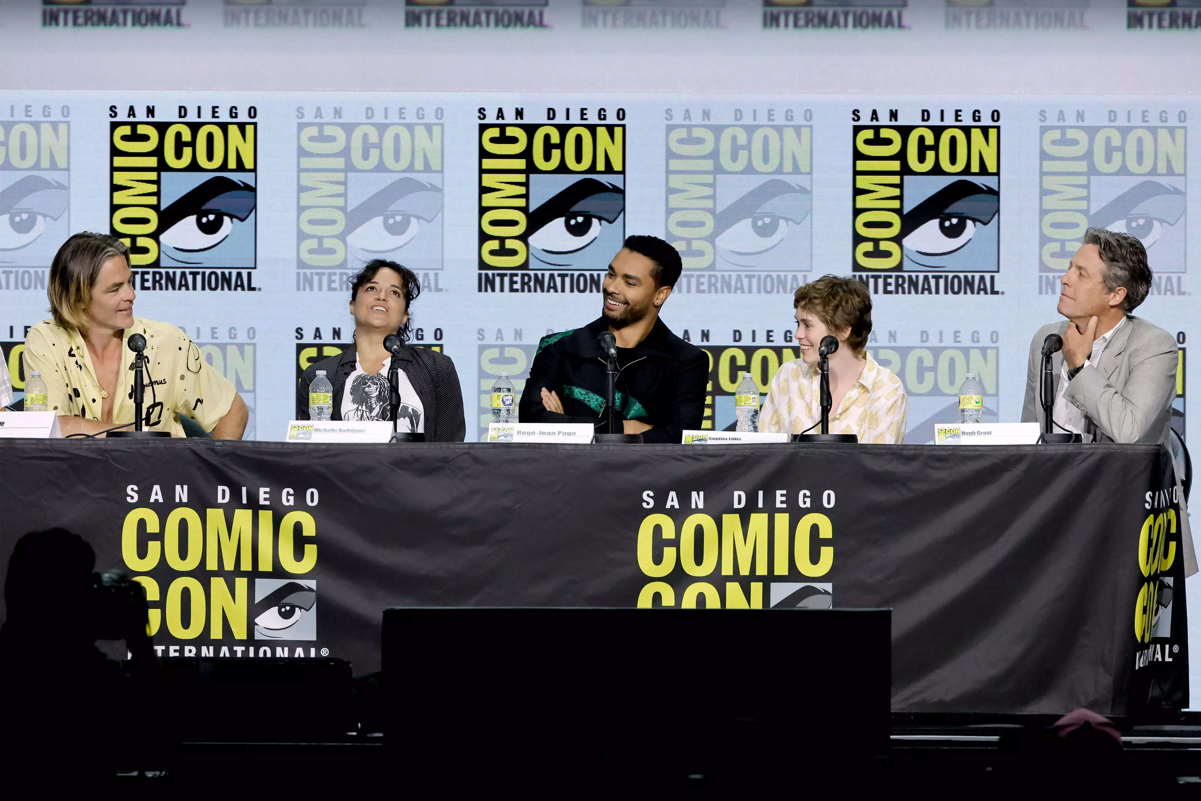 Chris Pine, Michelle Rodriguez, Regé-Jean Page, Sophia Lillis, and Hugh Grant speak onstage at the "Dungeons & Dragons: Honor Among Thieves" panel during 2022 Comic-Con International: San Diego at San Diego Convention Center on July 21, 2022 in San Diego, California.