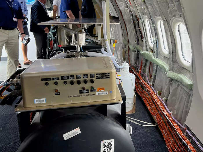 Walking inside, the first thing I noticed were giant black tanks. According to a Boeing flight test engineer on the plane, they are water barrels that are used to control the center of gravity during test flights.