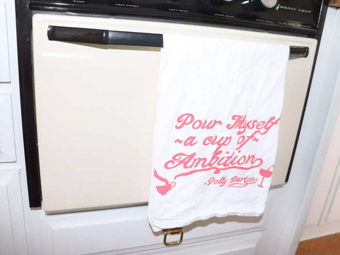A kitchen towel on the oven encourages guests to pour themselves a cup of ambition.