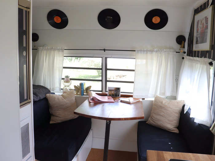 They removed a bunk from the front cabin and put in a sitting area to open up the space, which they decorated with Dolly Parton records and photos.