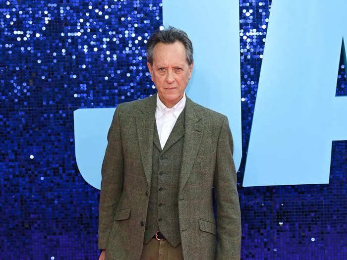 Richard E. Grant dresses like a modern-day version of his character.