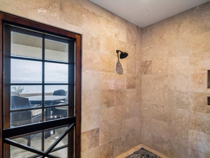 And of course, the large walk-in shower has a view of the ocean.