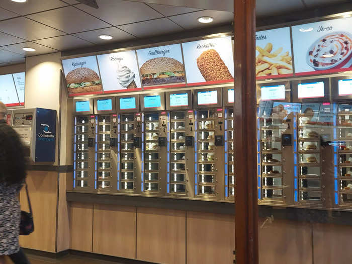 Individual food lockers sit on top of each other and are lined up in rows, and are topped up throughout the day as products are sold.