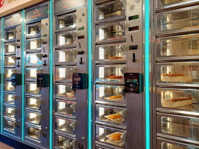 Automats are like self-service vending machines for hot food. They use rows of food lockers, sometimes heated, to store prepared food for customers to collect.