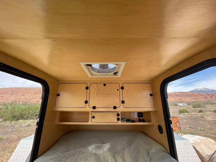 The camper had a door on each side and a fan in the ceiling.