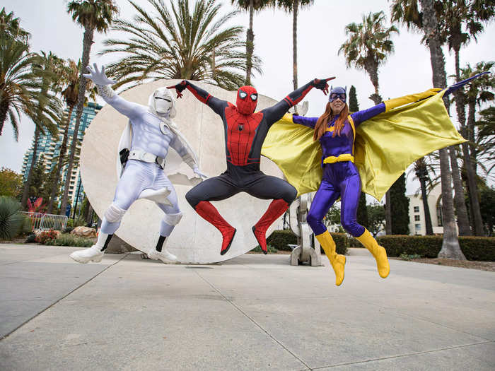 Yet another version of Moon Knight posed for a photo with Spider-Man and Batgirl cosplayers.