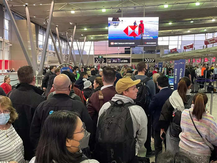 Sydney Airport was in chaos on Monday as technical issues caused huge lines for security, while heavy fog meant that some flights were delayed.