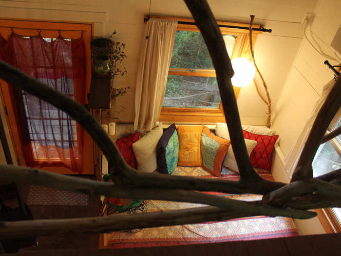 The bedroom is pretty high up, with some branches acting as a barrier between the lofted area and the downstairs.