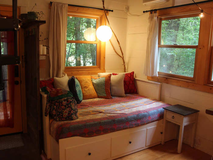 There was a daybed adorned with colorful blankets and pillows right when I walked into the tiny house.