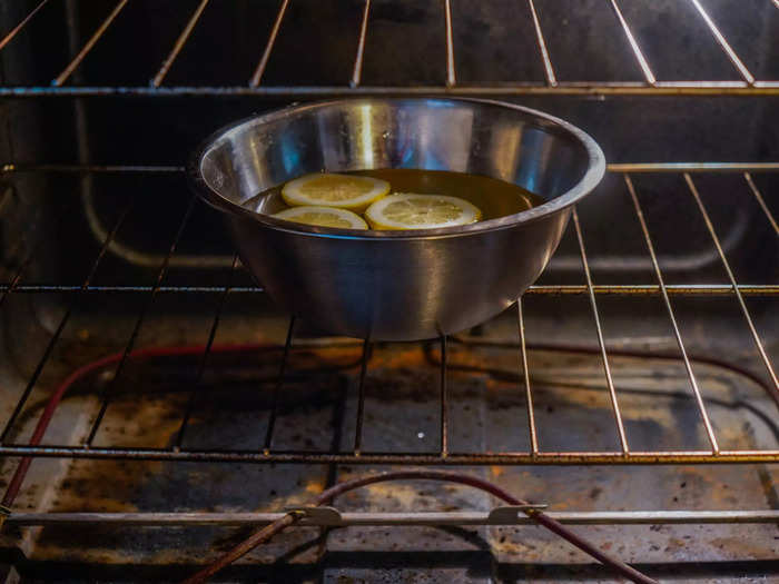 I placed the cut lemons in an oven-safe bowl filled with water, and then put the bowl in the oven. I waited about 30 minutes.