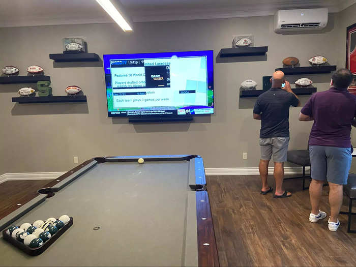 The pool room also has a TV, Michigan State-branded billiards balls, and the coach