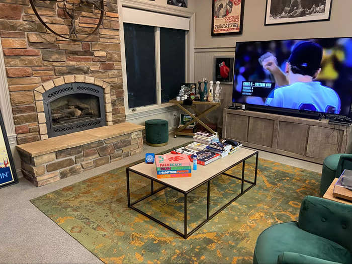 Off the side of the court is a sitting area, outfitted with a large TV and a fireplace, perfect for Michigan winters.