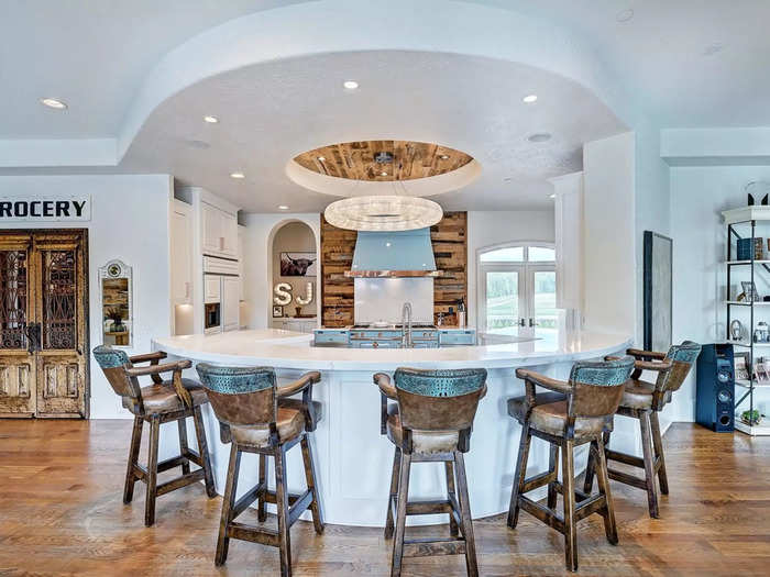 The kitchen with a rounded peninsula is gorgeous.