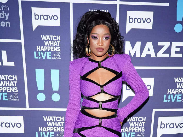 Palmer wore a purple minidress with cutouts along the front while chatting with Andy Cohen in November 2021.