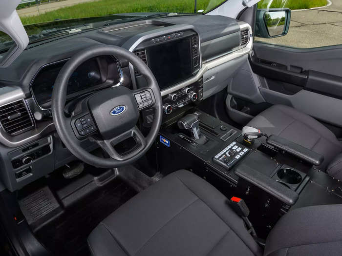 The interior has the same 12-inch screens as some other Lightning models. But it also offers mounting points for police equipment and heavy-duty, easy-to-clean materials.