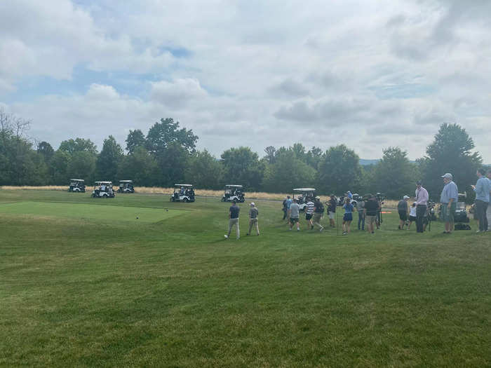 After the group hit their tee shots, golf carts scattered down the road to find the fairway. At times they moved like a school of fish.