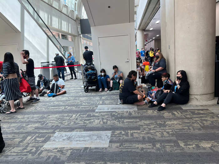 Attendees sat on the floor to catch a break before security guards inevitably walked by to tell them they weren