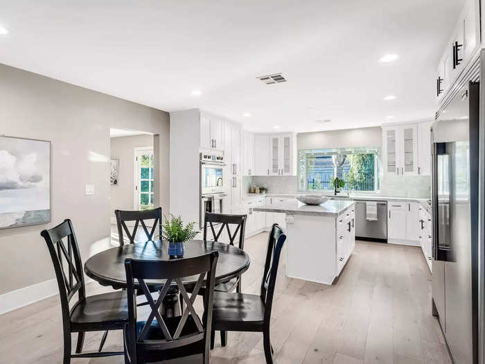 The eat-in kitchen has all new appliances and a window overlooking the backyard.