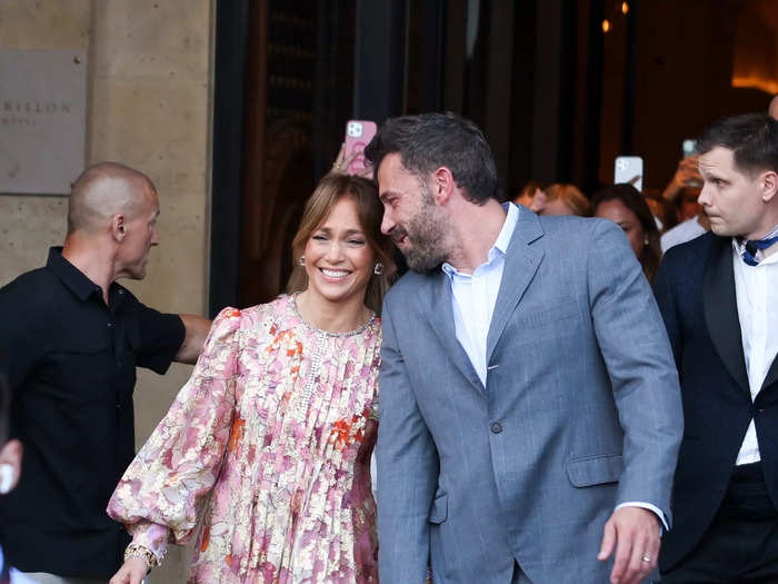 Building on her floral theme for the trip, Lopez wore a pink-and-orange maxi dress with pleats, puff sleeves, and silver detailing.