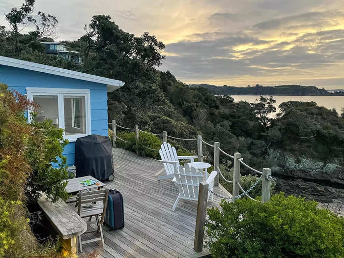 The tiny house was built into the cliff, and surrounding it was a wooden deck.