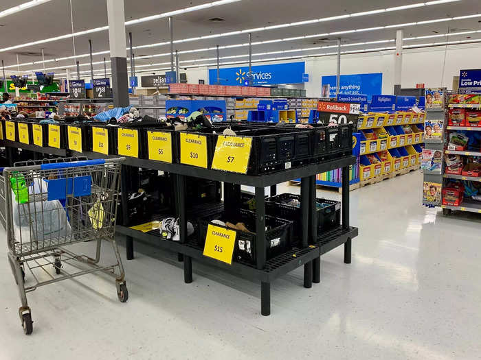 Near the checkout aisles of the store, bins were lined up with sale items displayed.