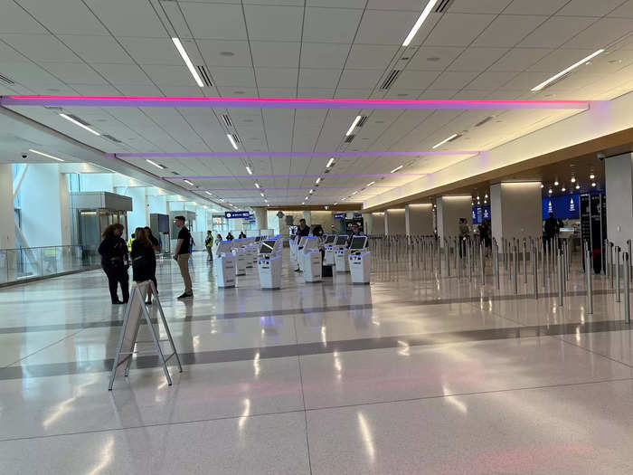 …while the check-in area has been designed as a "transient space" without much decor because LaGuardia is a main business hub for Delta, and those passengers do not typically check luggage.