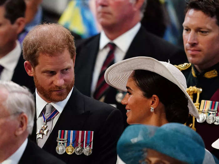 During their first public engagement with the royal family in over two years this June, Harry was pictured looking at Markle as she smiled softly at him.