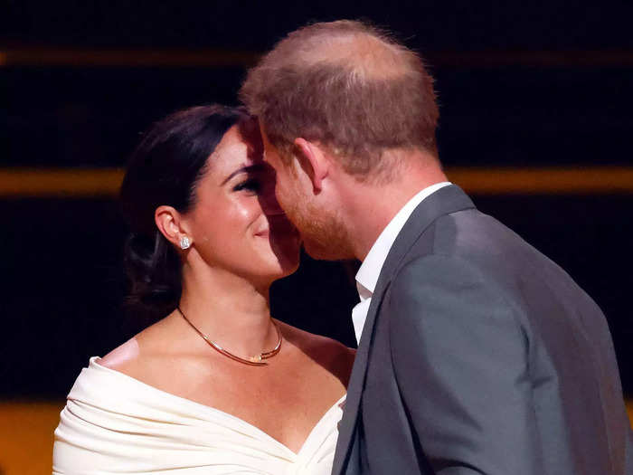 Later at the opening ceremony, Markle and Harry shared a kiss on-stage.