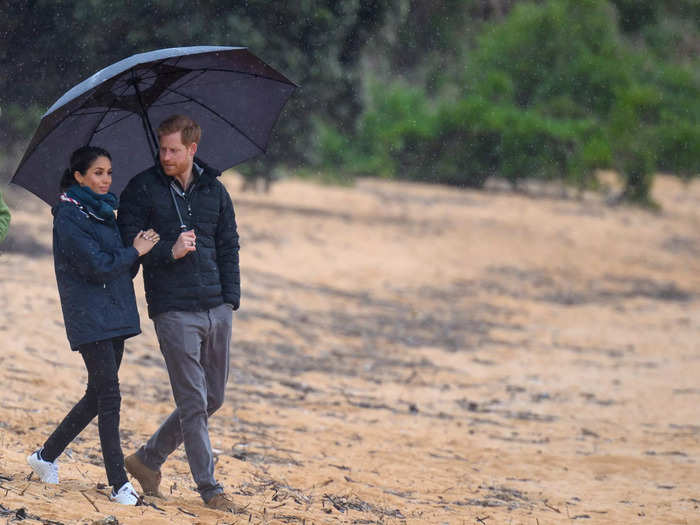 Later on the royal tour, the couple strolled through a national park in New Zealand where Markle was seen looping her arm around Harry