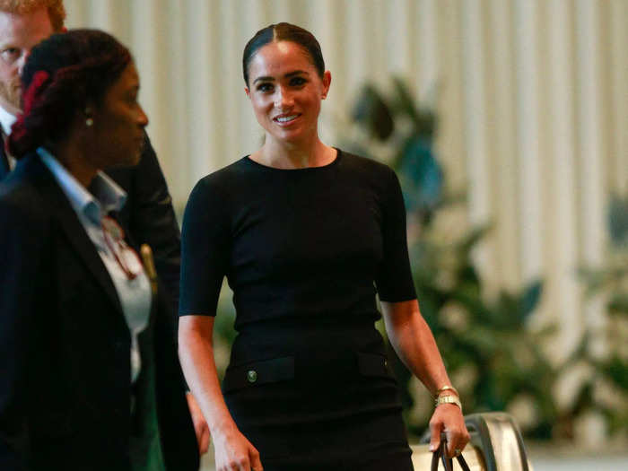 But at a United Nations event just a month later in July, Markle again seemed to shift her style, rocking a fashion-forward ensemble. She paired a quarter-length black shirt with a black pencil skirt from Givenchy.