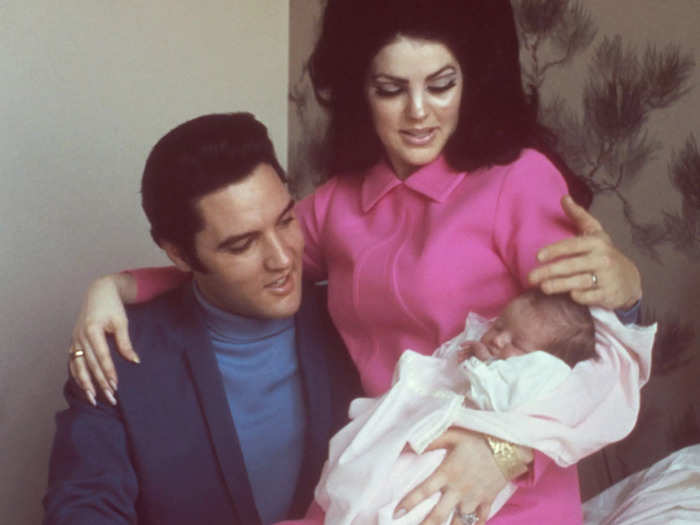 After the birth of their daughter Lisa Marie, Priscilla Presley was photographed wearing a bright fuchsia dress she bought at Neiman Marcus.