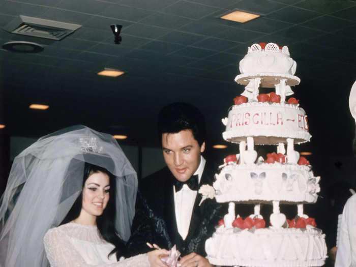 For her wedding day on May 1, 1967, Priscilla Presley wore a trapeze-style dress with sheer sleeves and a large, flowing veil.