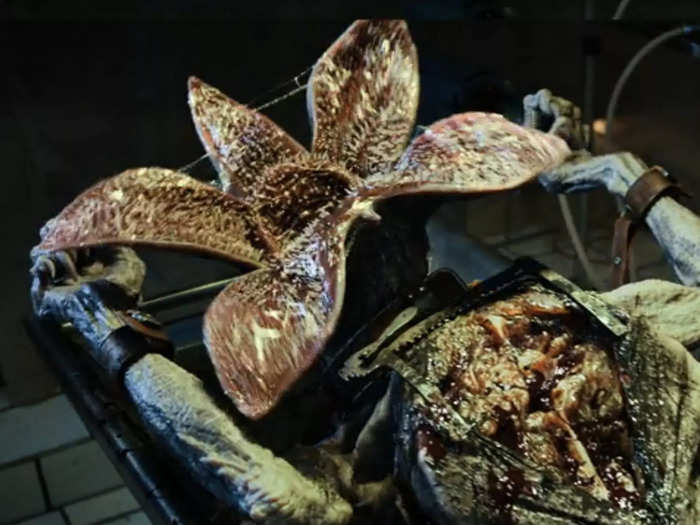 How did the Russians manage to trap part of the Mind Flayer particles? What were they doing with the Demogorgon they had opened on an operating table?