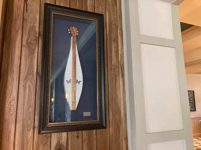 The walls were decorated with framed instruments that Parton has used throughout her career.