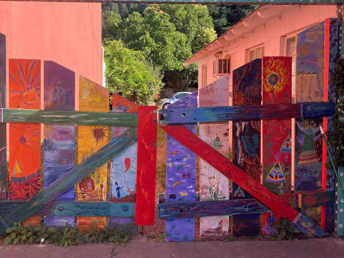 The small town is rich with public artwork and brimming with murals on the sides of buildings and fences.