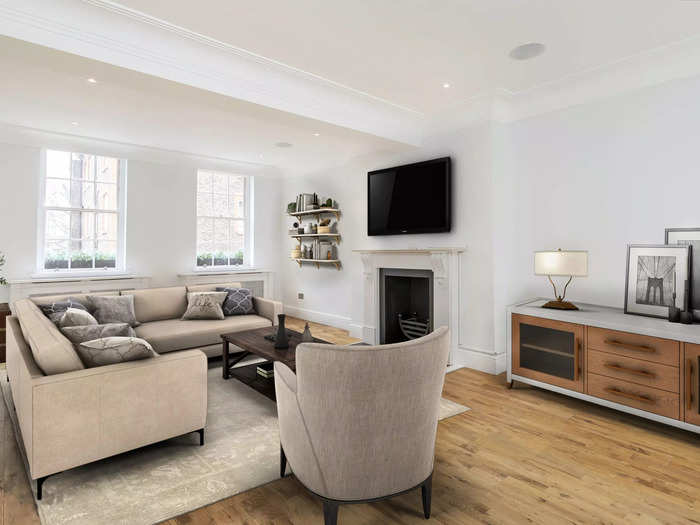 The wood-floored living room shows how much light the home gets, which is a special characteristic of skinny houses, according to Dexters.