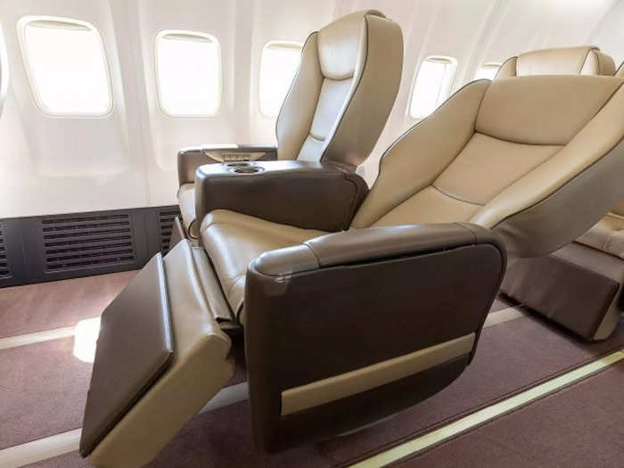 …and large leather seats with a 140-degree recline, a legrest, and 52 inches of pitch.