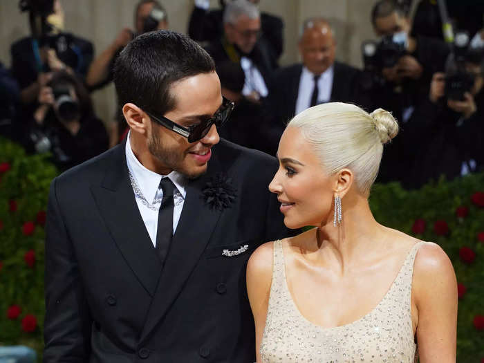 2. The couple smiled at each other at the 2022 Met Gala, where Kim made a major statement while wearing Marilyn Monroe