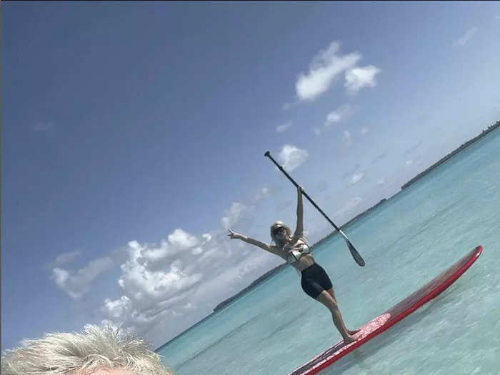 4. Davidson snapped a selfie as Kardashian floated by on a paddle board behind him while the two vacationed in June.