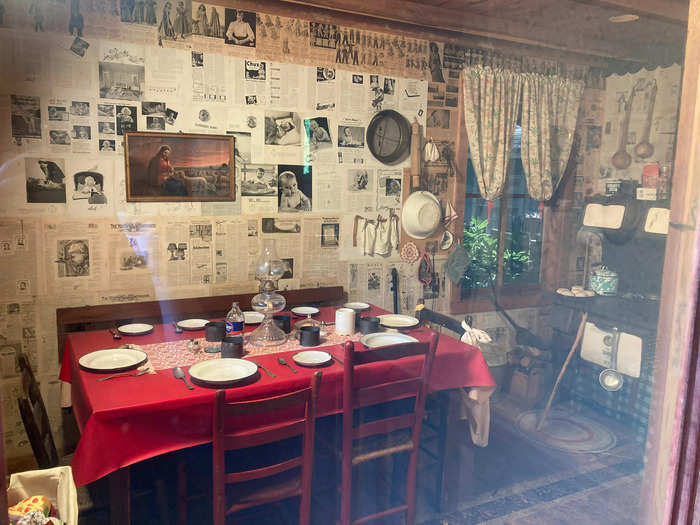 The dining area featured a small table and a wood burning stove.