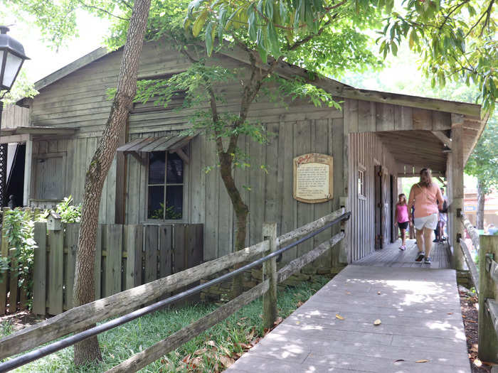 Parton grew up in the two-room log cabin with her parents and 11 siblings.